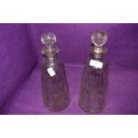 Two Victorian glass decanters, having etched detailing.