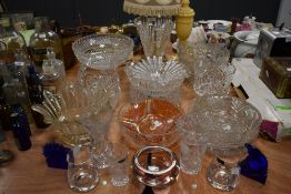 An array of glass ware, including Dartington glasses, cut and pressed glass fruit bowls, vases and