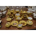 A large of of Aynsley 'Orchard gold' including cups and saucers, trinket pots,and more.