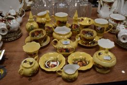 A large of of Aynsley 'Orchard gold' including cups and saucers, trinket pots,and more.