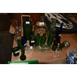 A collection of glass medical bottles, eye baths, codd bottles and more.