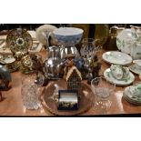 A mixed lot containing glass ware, stainless steel, cufflinks and a copper charger, wooden figurines