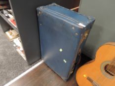 A vintage Herculax suitcase in teal blue