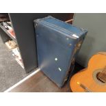 A vintage Herculax suitcase in teal blue