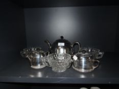 A mid century insulated tea pot, jug and sugar basin, having cream ceramic bodies with chrome