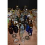 A super selection of vintage glass bottle and jars, included are sweet jars, Ochre glass medical