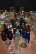 A super selection of vintage glass bottle and jars, included are sweet jars, Ochre glass medical