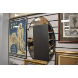 A vintage wooden backed large oval bevelled edge mirror.