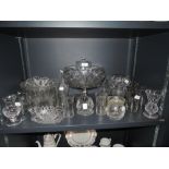 A selection of clear cut and crystal glass wares including footed tazza etched and cut tumblers