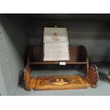 A selection of Beatrix Potter story books on oak shelf and a Sorrento extendable book shelf