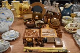A selection of wood, including animal figurines, trivets, bowls, letter racks and more.