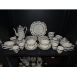 A part coffee service by Stanley on white ground with gilt detailing