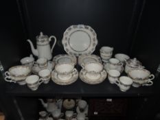 A part coffee service by Stanley on white ground with gilt detailing