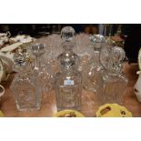 Six vintage glass decanters, various shapes and styles.