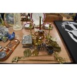 An assortment of metal ware, including toast rack, candle snuffer, horn, embossed trinket box and