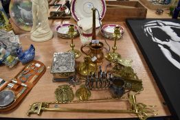 An assortment of metal ware, including toast rack, candle snuffer, horn, embossed trinket box and