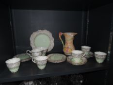 A part tea service by Royal Stafford in a green ground and gilt finish and Arthur wood vase