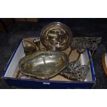 A vintage foldable brass book stand having ornate ends and a selection of plated ware also two