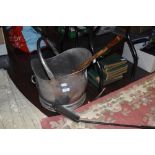 A stainless coal bucket/helmet,a shovel and a long shoe horn.