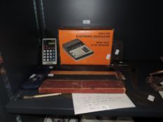 A selection of desktop office items including geometry interest and calculator