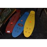 Three plastic banana boards.