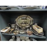 An impressive selection of silver plated items including cake stand, tea set, and cutlery