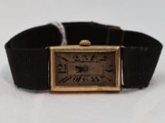 A lady's vintage 9ct gold wrist watch having an Arabic numeral dial in a rectangular gold case on