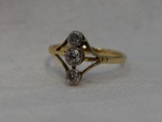 A lady's dress ring having a trio of diamonds, total approx 0.33ct in collared mounts on open triple