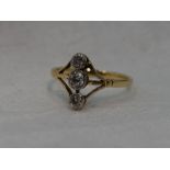 A lady's dress ring having a trio of diamonds, total approx 0.33ct in collared mounts on open triple