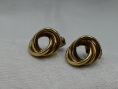 A pair of 9ct gold triple loop stud earrings