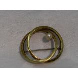 A yellow metal double loop brooch stamped 585 having cultured pearl decoration