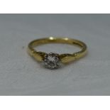 A lady's diamond solitaire dress ring, approx 0.25ct in a claw set raised mount to shaped