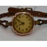 A lady's vintage 9ct rose gold Rolex wrist watch having an Arabic numeral and gilt dot dial in