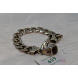 A lady's white metal curb chain bracelet stamped 925 of chunky form having dog leash clasp, and a