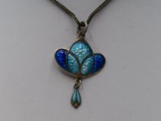 An Edwardian silver and enamel Art Nouveau pendant in shades of blue, Birmingham 1908, James
