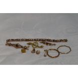 A selection of 9ct gold and yellow metal jewellery including watch strap stamped 9ct, odd