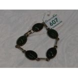 A five stone Jade style cabouchon bracelet in collared mounts with HM silver interconnecting bars