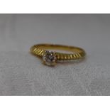 A lady's dress ring having a diamond solitaire, approx 0.40ct in a four claw raised setting to