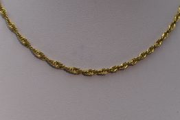 A yellow metal open rope chain stamped 750, approx 18' & 4.7g
