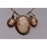 A conche shell cameo brooch/pendant depicting a maiden in profile in a decorative 9ct gold mount