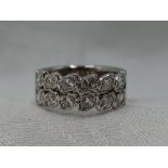 A lady's dress ring of band form having a double row of marquise cut diamonds, total approx 1.25ct