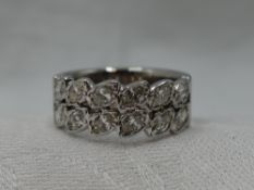 A lady's dress ring of band form having a double row of marquise cut diamonds, total approx 1.25ct
