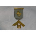 A Masonic jewel stamped 9ct regarding the Hope & Unity Lodge no: 214, awarded to W Bro W J