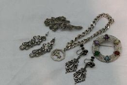 A small selection of white metal jewellery including a curb link bracelet and charm stamped 925/