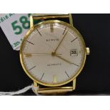 A gents Marvin automatic 18ct gold wrist watch,no:90837, having a baton numeral dial with date