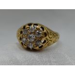 A Victorian 18ct gold signet ring having a diamond cushion cluster, approx 0.4ct to moulded