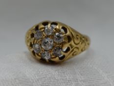 A Victorian 18ct gold signet ring having a diamond cushion cluster, approx 0.4ct to moulded