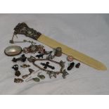 A small selection of HM silver and white metal including a thimble, page turner, loose charms,