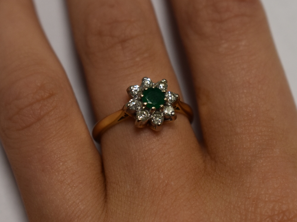 A lady's dress ring having an emerald and diamond cluster in a claw set mount on an 18ct gold - Image 8 of 8