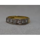 A lady's half eternity ring having six diamonds, total approx 0.38ct in pave mounted channel setting